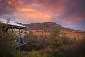 Rawnsley Park - couple taking in the view out over Wilpena Pound - Outback Australia Flinders Ranges