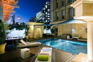 Perth - Duxton Hotel swimming pool at night - luxury short breaks on private aircraft