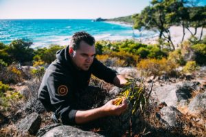 Josh Whiteland foraging for edible native plants at Castle Rock, Dunsborough.