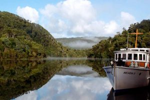 Corinna - fog lifting over the Pieman river - luxury short breaks Tasmania