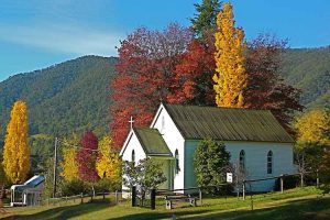 Harrietville - quaint Church surrounded by autumn trees - Luxury short breaks Australia